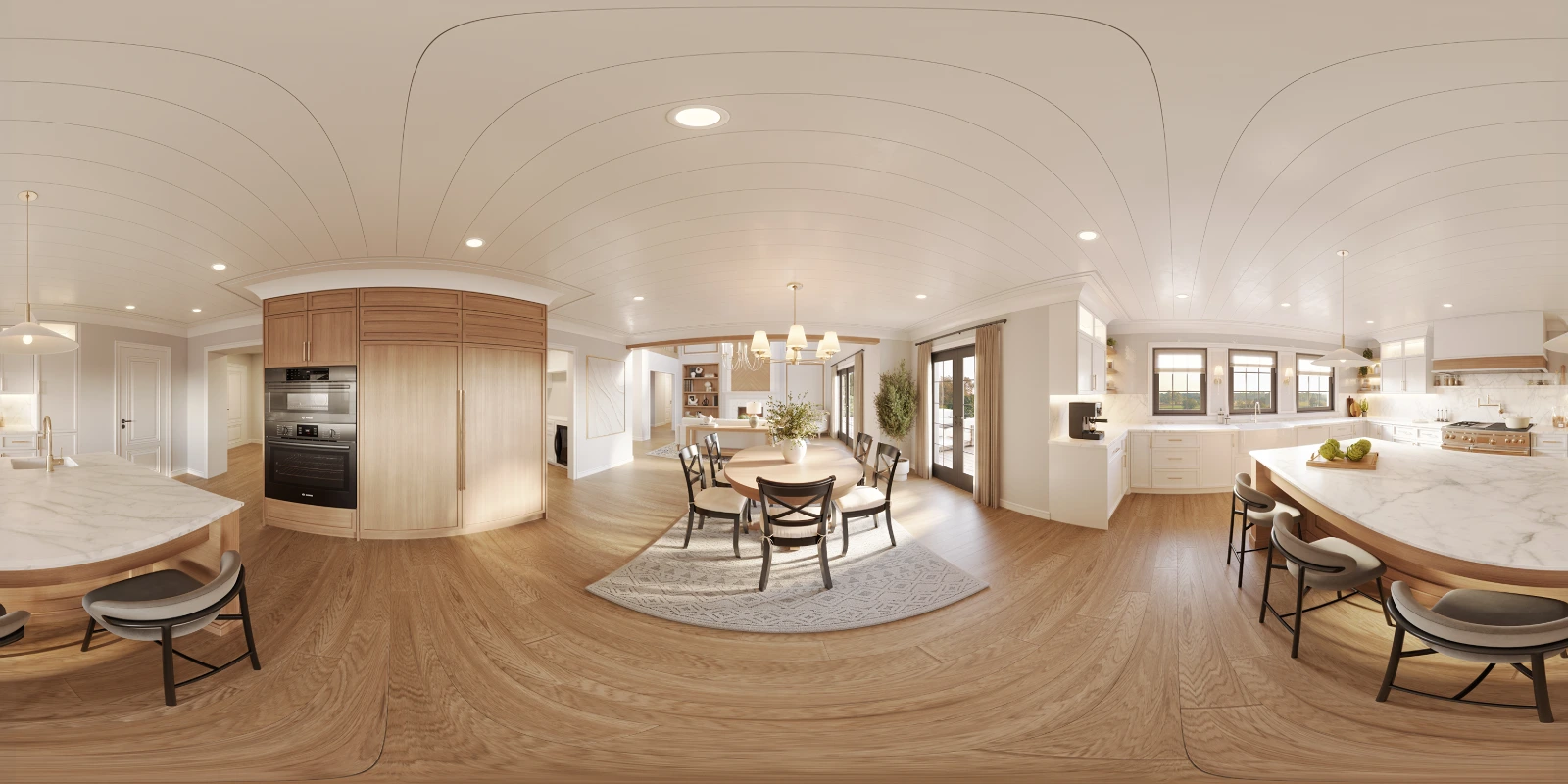 High-quality 360-degree panoramic architectural interior visualization of a spacious, open-concept kitchen and breakfast area. The equirectangular projection reveals a warm, bright space featuring a large white curved ceiling with subtle plank details, light wood flooring, and extensive natural wood cabinetry with built-in modern appliances. To the right, a large kitchen island with a marble countertop provides seating, while the center highlights a round dining table set on a patterned area rug, connecting seamlessly to other living spaces.
