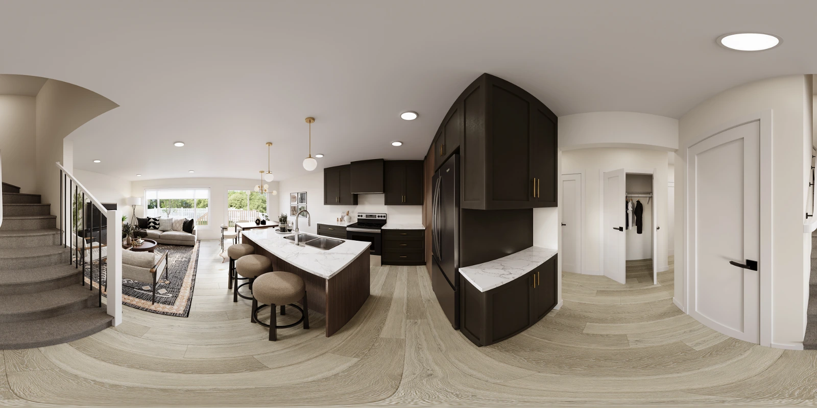 High-quality 360-degree panoramic architectural interior visualization of a modern open-concept main floor . The equirectangular projection showcases a stylish kitchen featuring dark espresso cabinetry, white quartz countertops, and a central island with round bar stool seating . The space flows seamlessly into a cozy living area with a patterned area rug and seating, adjacent to a carpeted staircase on the left . Light wood flooring extends throughout the space, connecting the kitchen, living room, and a bright hallway leading to the entryway on the right