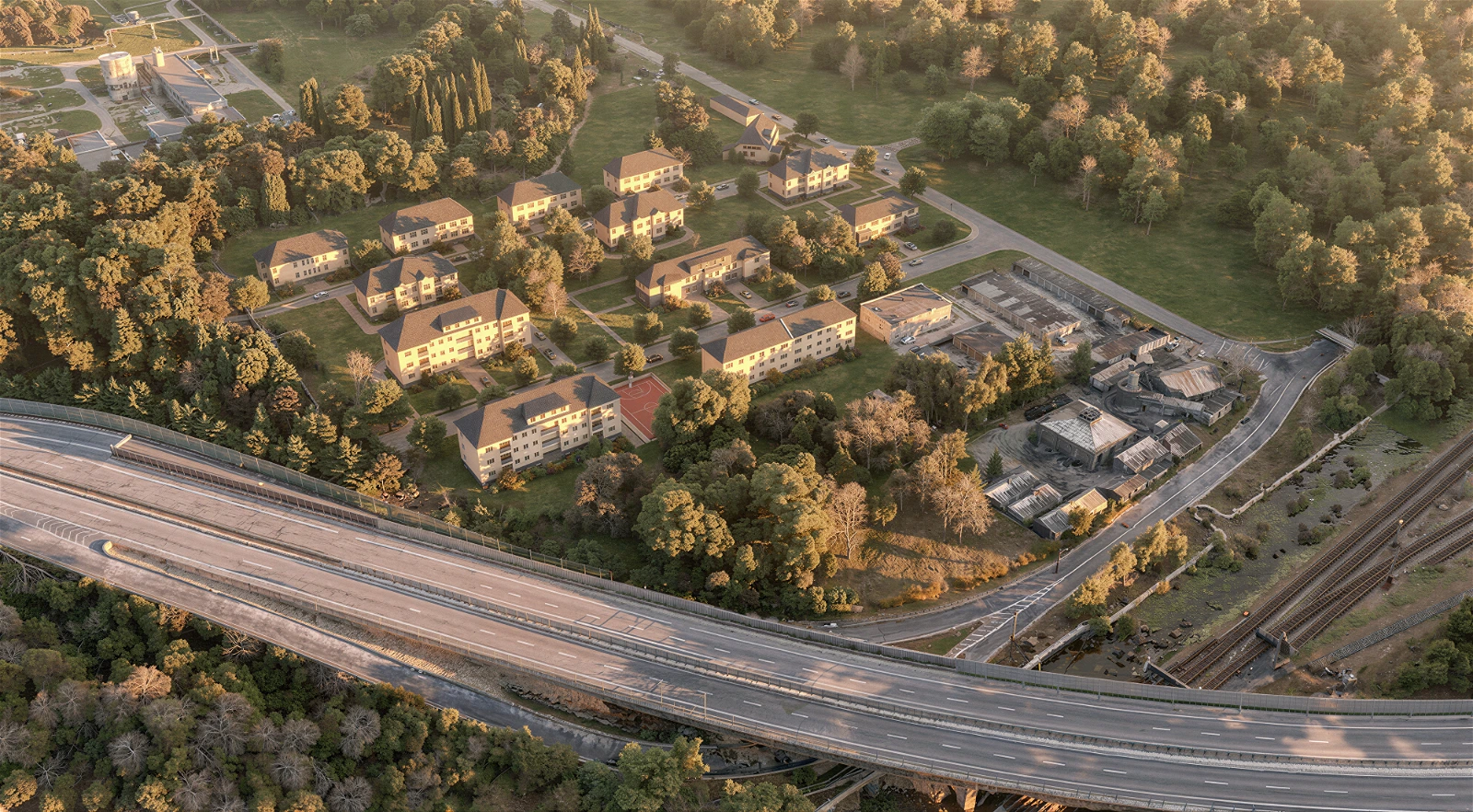 High-altitude aerial photomontage of a residential complex nestled in a heavily wooded area during golden hour . The 3D architectural visualization features a cluster of multi-story apartment buildings surrounded by trees, with a large, sweeping multi-lane highway overpass dominating the foreground . Railway tracks and an older commercial or industrial facility are visible to the right, blending the development seamlessly into a realistic landscape