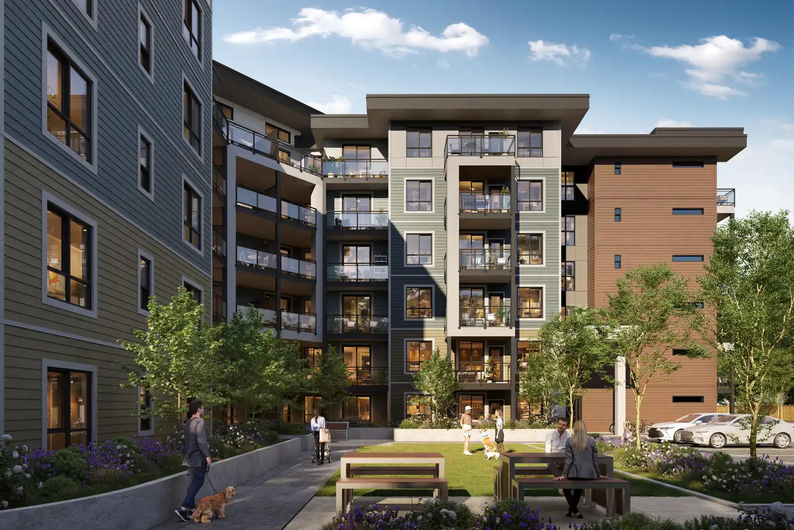 High-quality 3D architectural exterior visualization of a modern multi-story apartment complex, focusing on the vibrant inner courtyard from a ground-level perspective. The building features a contemporary mix of gray, green, and brown siding with glass-railed balconies. The active community space includes residents walking dogs, relaxing at wooden picnic tables, and strolling along paved pathways bordered by landscaped planters with purple flowers under bright daylight.