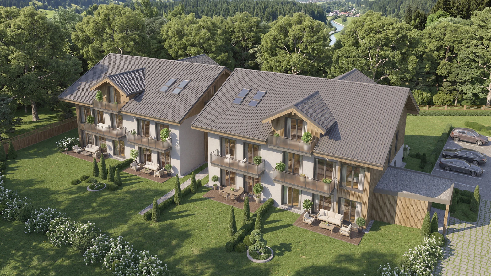 High-quality 3D architectural exterior visualization providing an aerial view of a modern multi-family residential complex in a lush countryside setting . The two main buildings feature steep pitched grey roofs with skylights, warm wooden cladding accents, and multiple glass balconies overlooking manicured green lawns and ground-level patio areas . A paved parking area with cars is visible to the right, and the background showcases a scenic landscape with a winding river and dense forests.